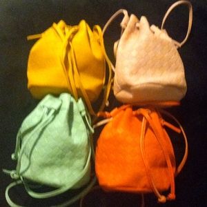 4 mini bucket crossbody purses. Yellow,pink,mint green,orange.